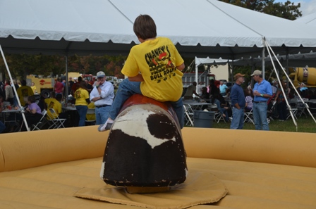 Spencer Bunn takes a short break from volunteering to check out his bullriding skills.